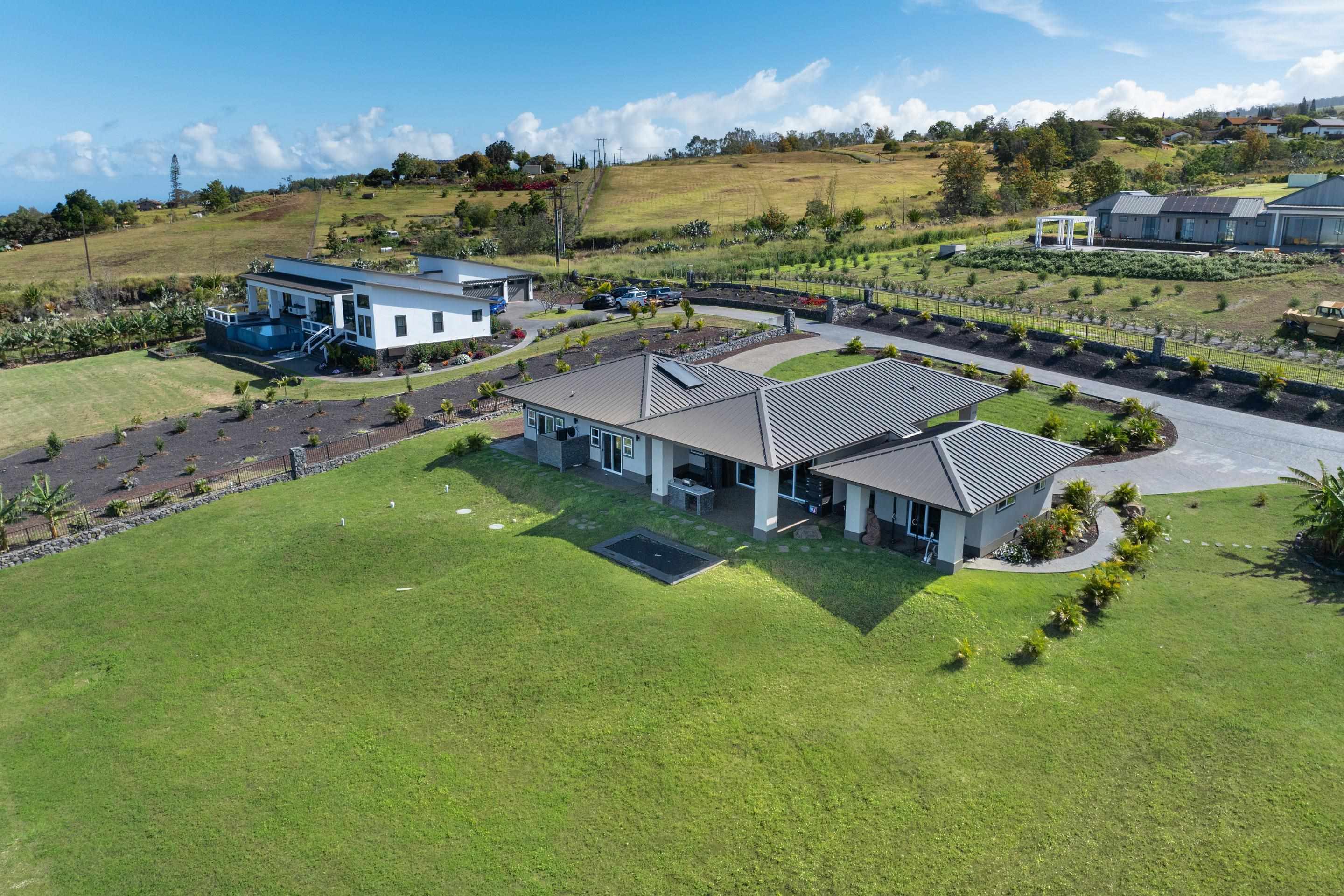 272 Huahua Street Kula, HI 96790 - Photo 1 of 43 an aerial view of residential houses with outdoor space and city view