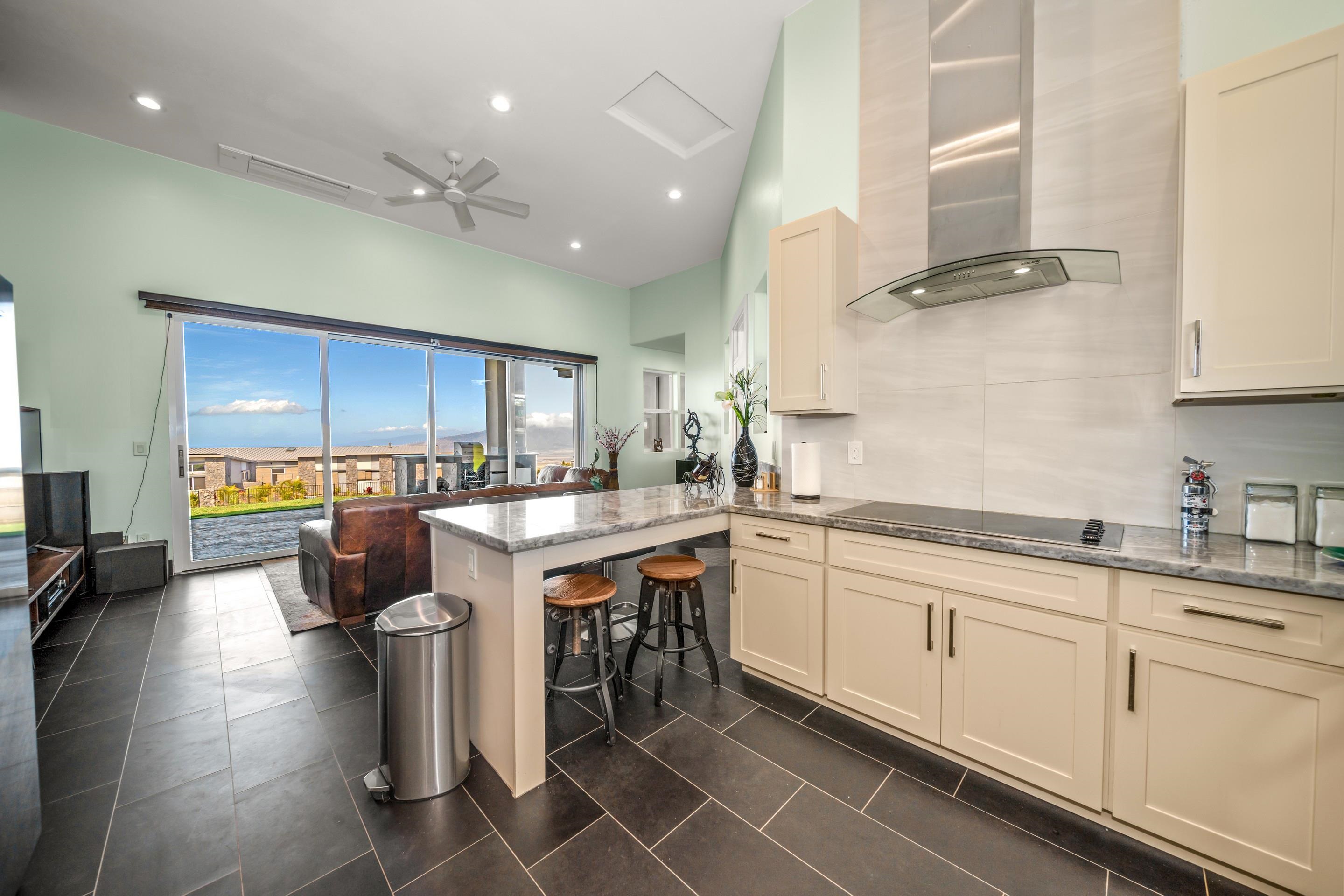 272 Huahua Street Kula, HI 96790 - Photo 16 of 43 a large kitchen with lots of counter space a sink and appliances