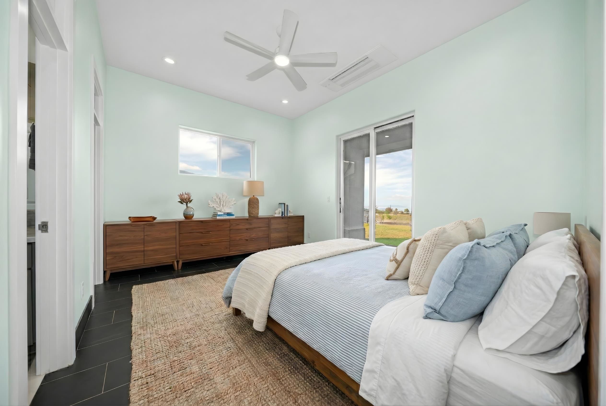 272 Huahua Street Kula, HI 96790 - Photo 19 of 43 a bedroom with a bed and window