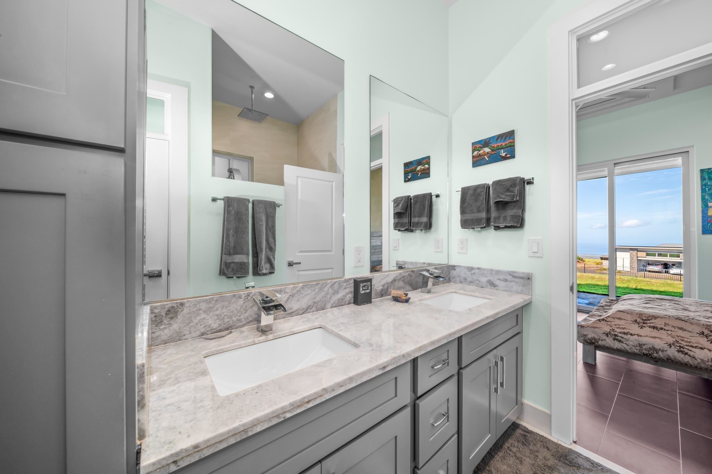 272 Huahua Street Kula, HI 96790 - Photo 23 of 43 a bathroom with a granite countertop sink and a mirror