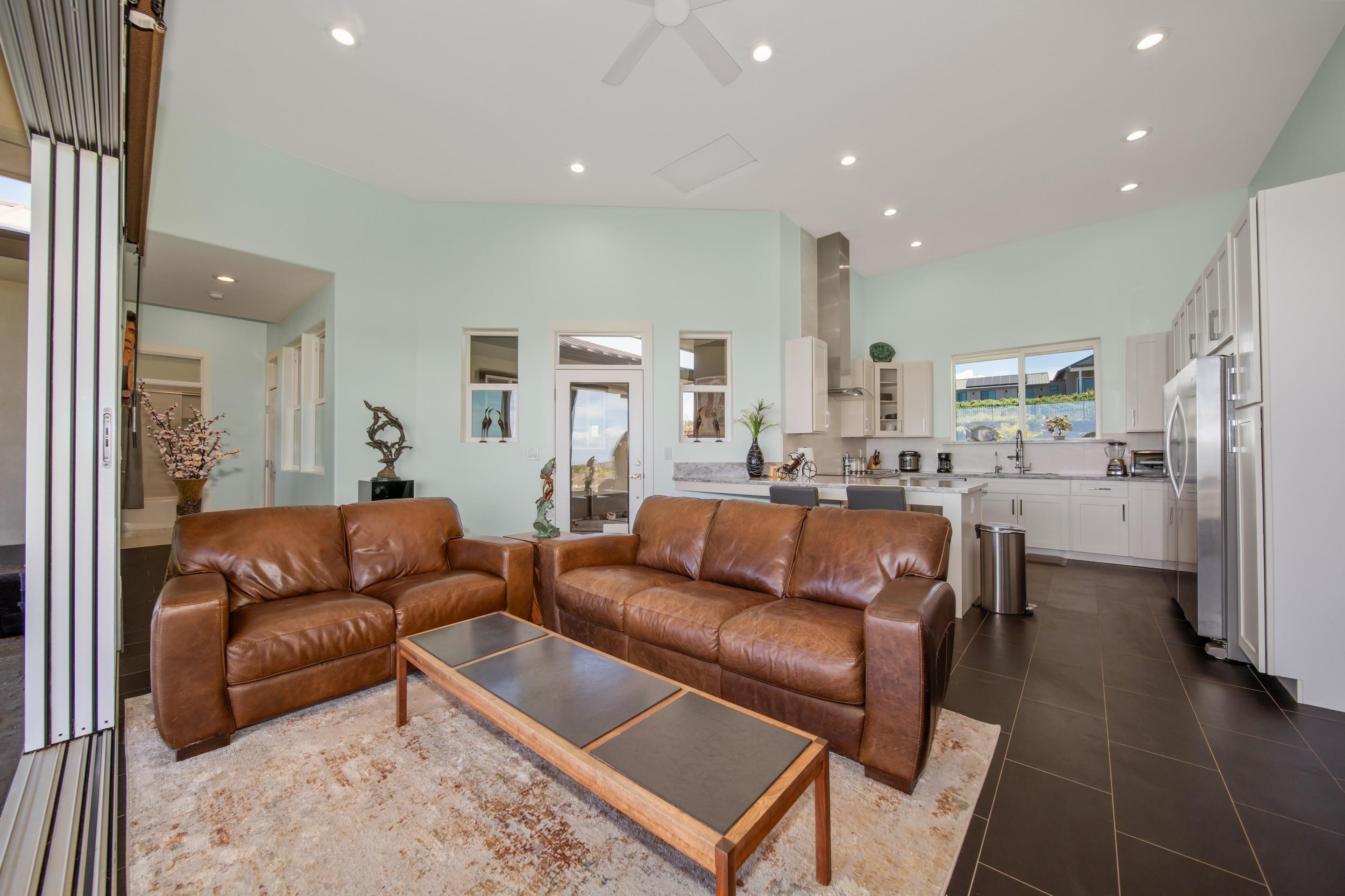 272 Huahua Street Kula, HI 96790 - Photo 10 of 43 a living room with furniture and a view of kitchen