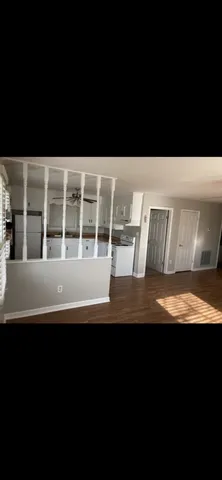 a view of house with backyard