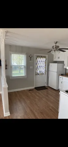 a view of empty room with windows