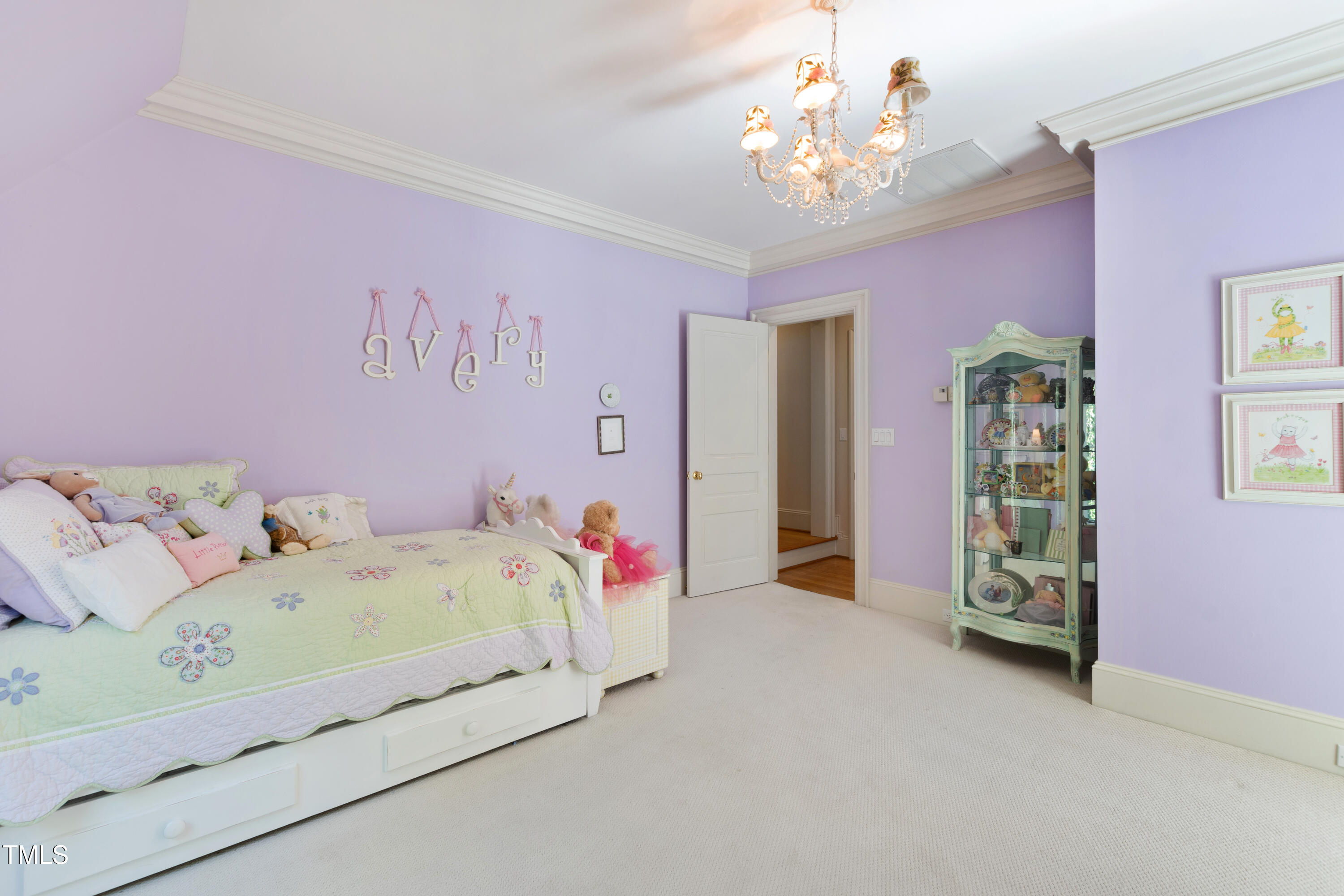 2658 Davis Street Raleigh, NC 27608 - Photo 67 of 99 a bedroom with a bed and a chandelier