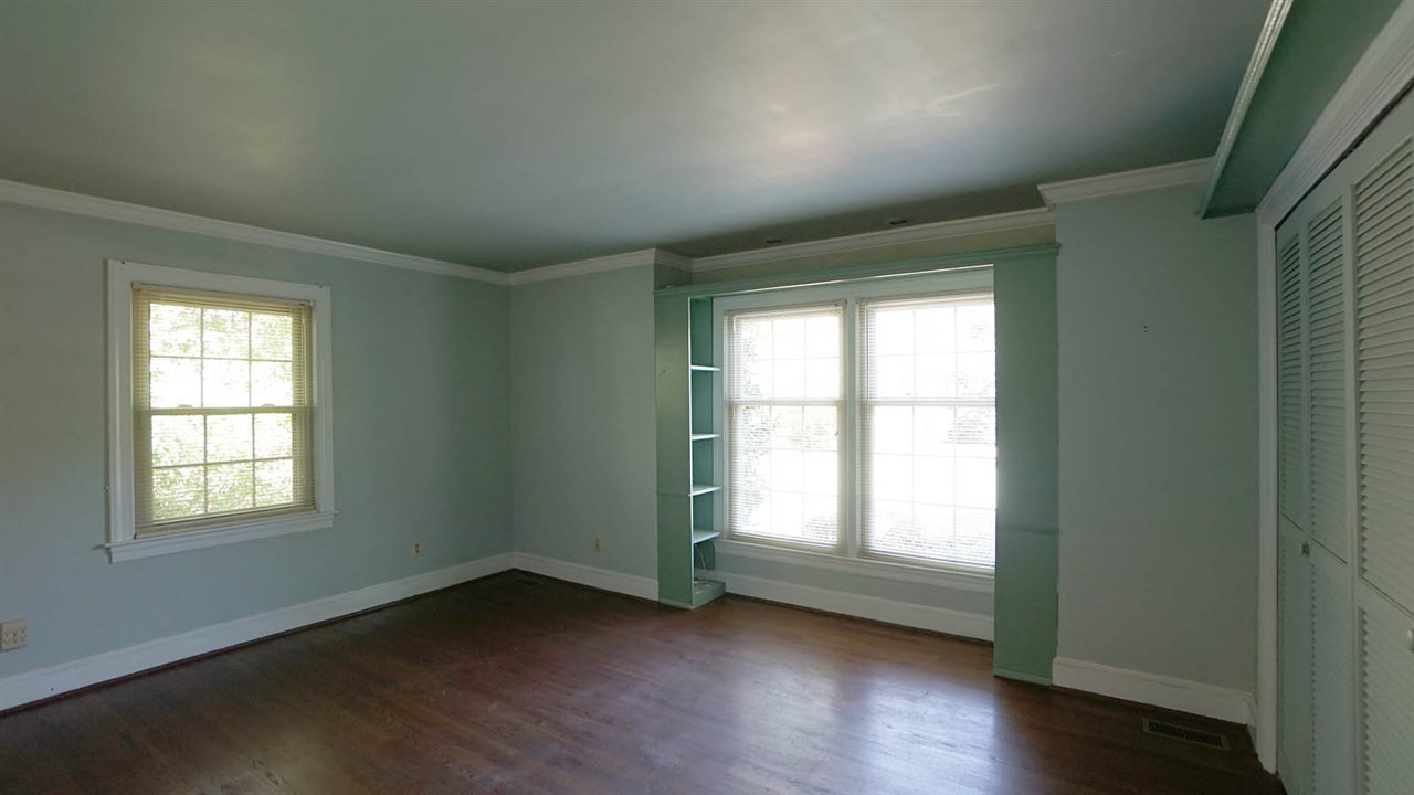 1421 Lynn Road Raleigh, NC 27612 - Photo 18 of 30 Good sized, good closet space, ensuite bathroom, with original tile floor thats in excellent condition and back in style today Guest Bedroom