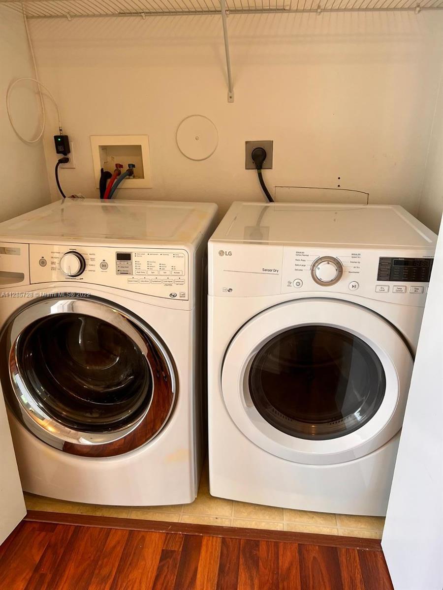 Lakeview Deerfield Beach, FL 33442 - Photo 11 of 14 a utility room with dryer and washer