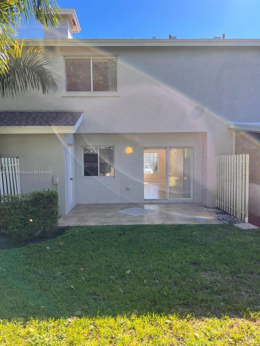 Lakeview Deerfield Beach, FL 33442 - Photo 14 of 14 a view of front door of house with yard