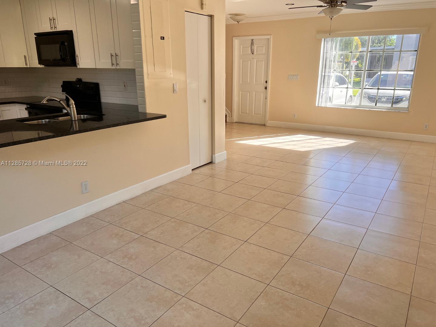 Lakeview Deerfield Beach, FL 33442 - Photo 5 of 14 a view of a kitchen with an empty space and a window