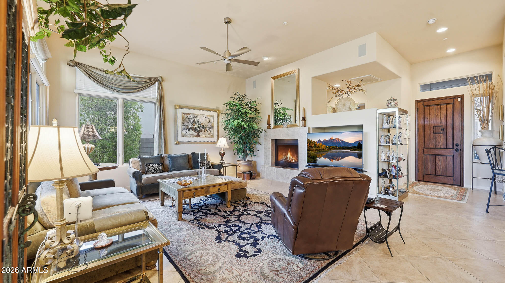 14341 East Geronimo Road Scottsdale, AZ 85259 - Photo 12 of 40 a living room with furniture fireplace and a large window