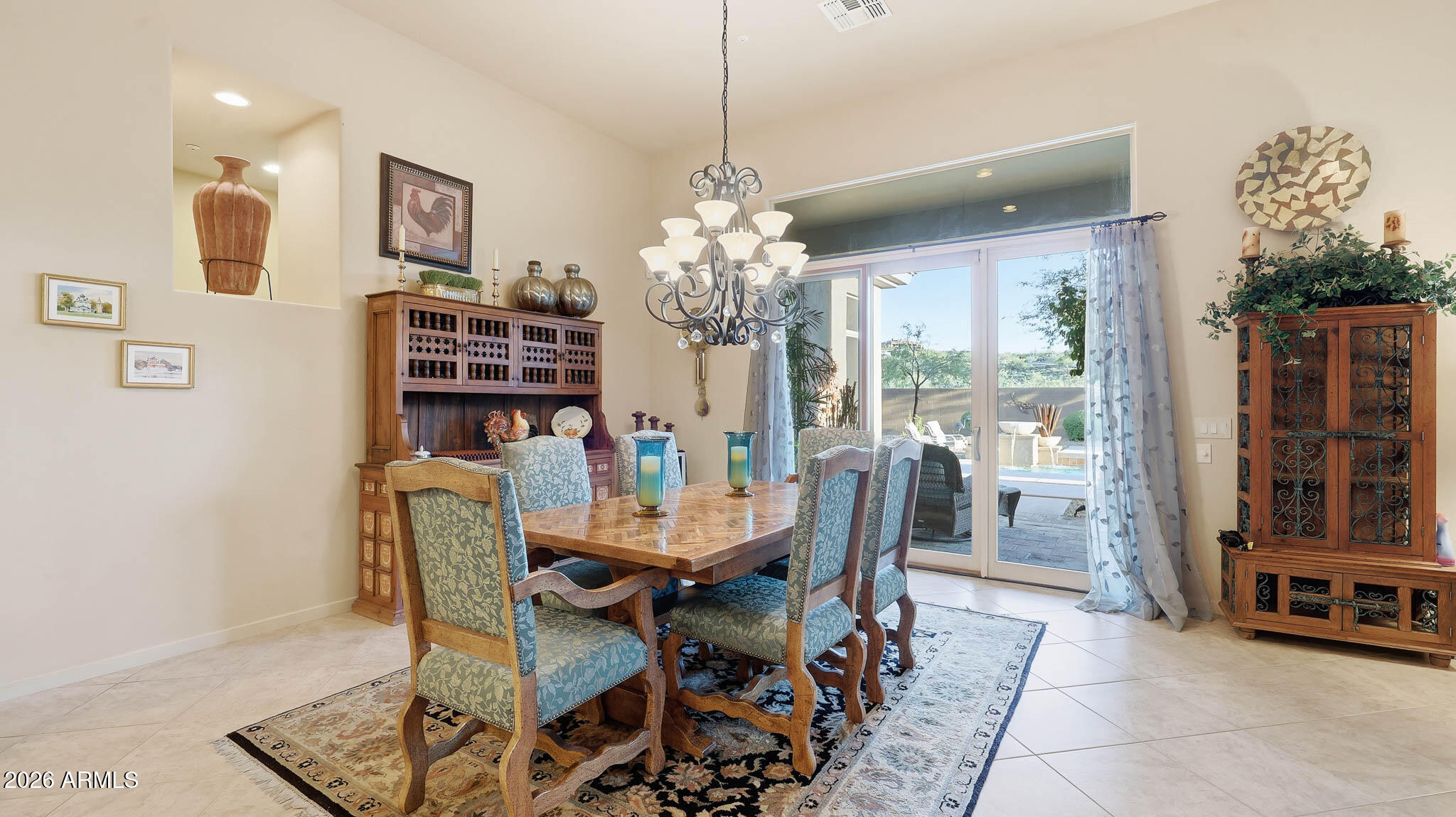 14341 East Geronimo Road Scottsdale, AZ 85259 - Photo 14 of 40 a view of a dining room with furniture and chandelier