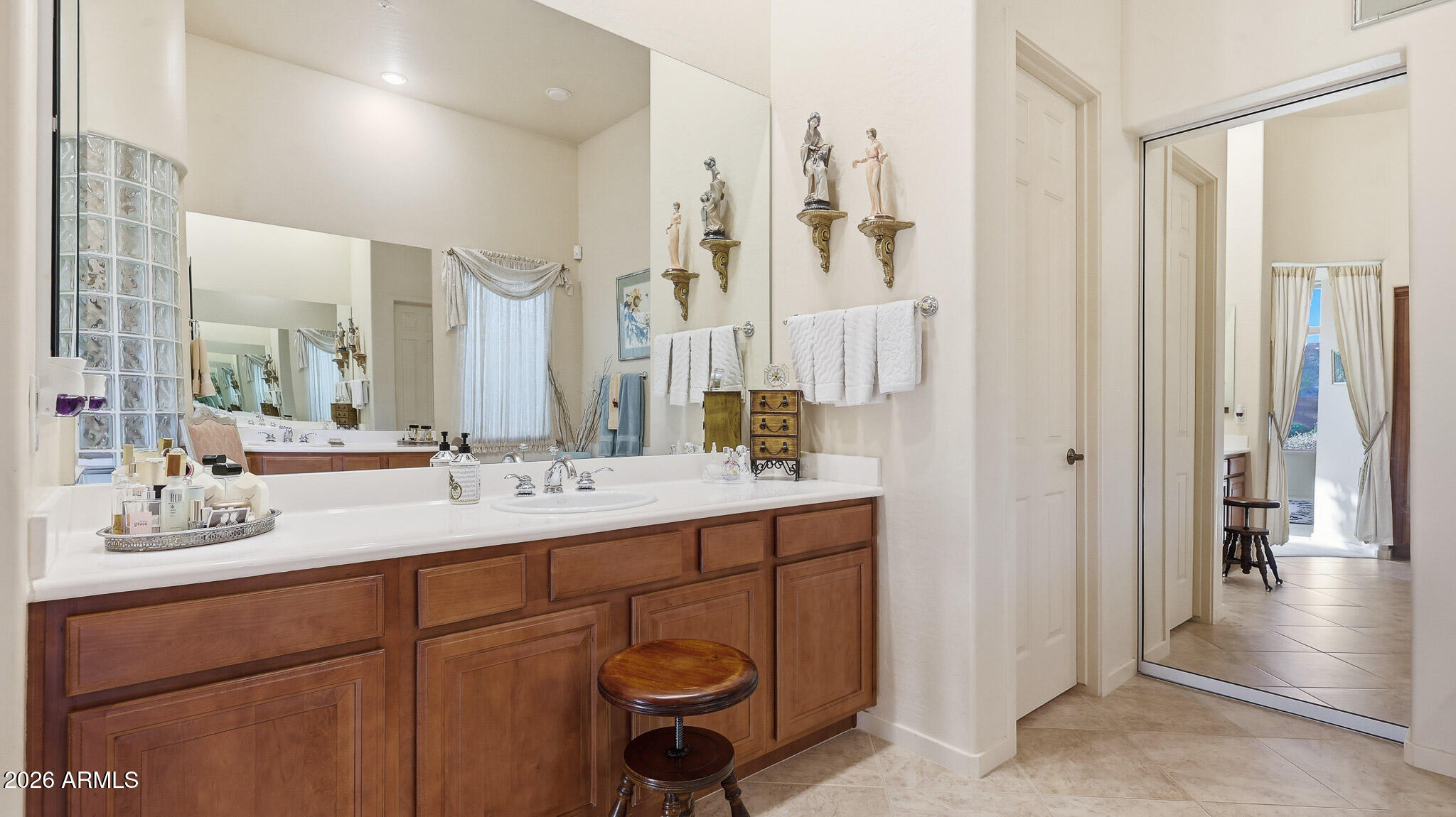 14341 East Geronimo Road Scottsdale, AZ 85259 - Photo 18 of 40 a bathroom with a double vanity sink a mirror and a shower