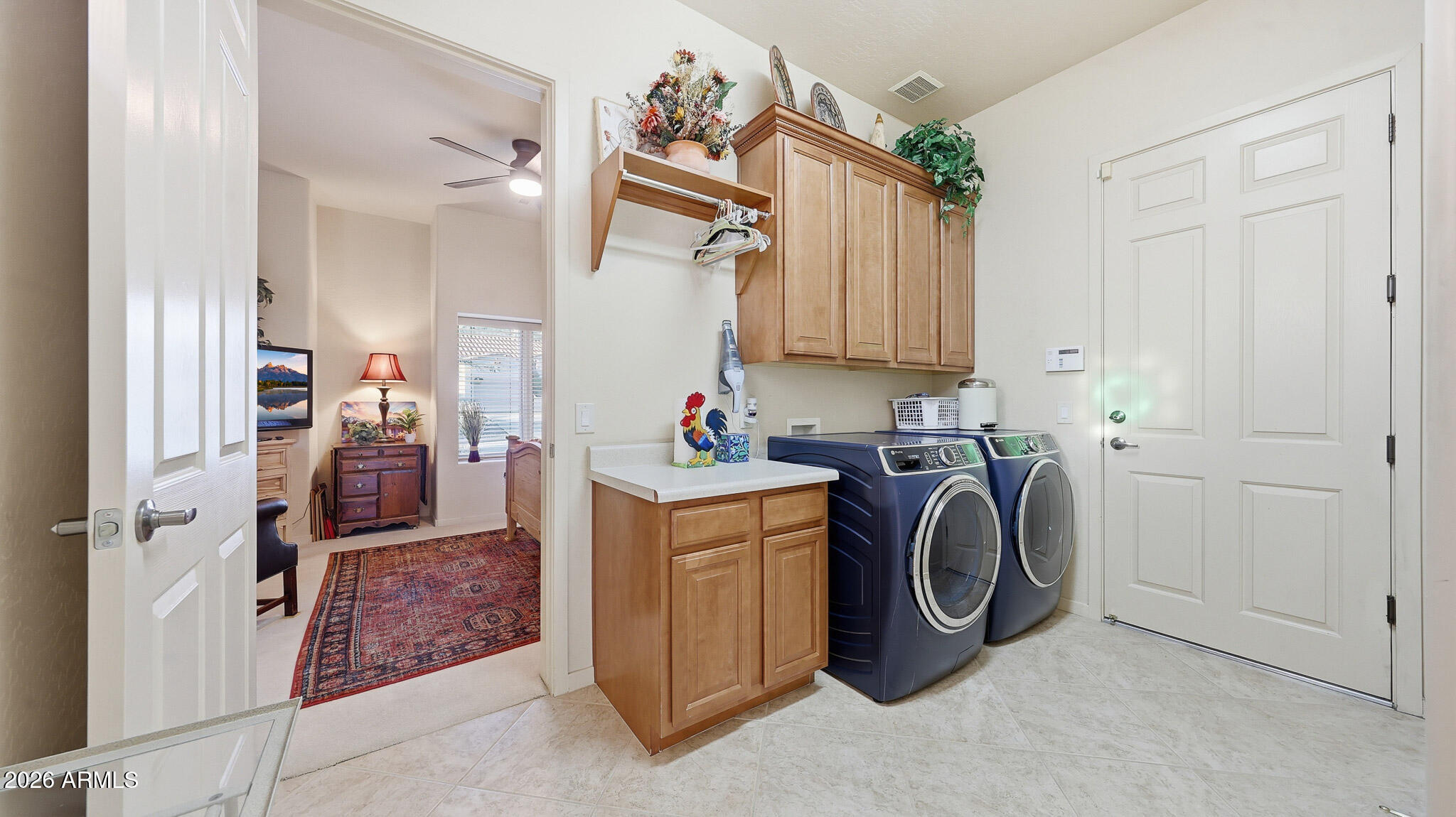 14341 East Geronimo Road Scottsdale, AZ 85259 - Photo 26 of 40 a view of a storage and utility room with washer and dryer
