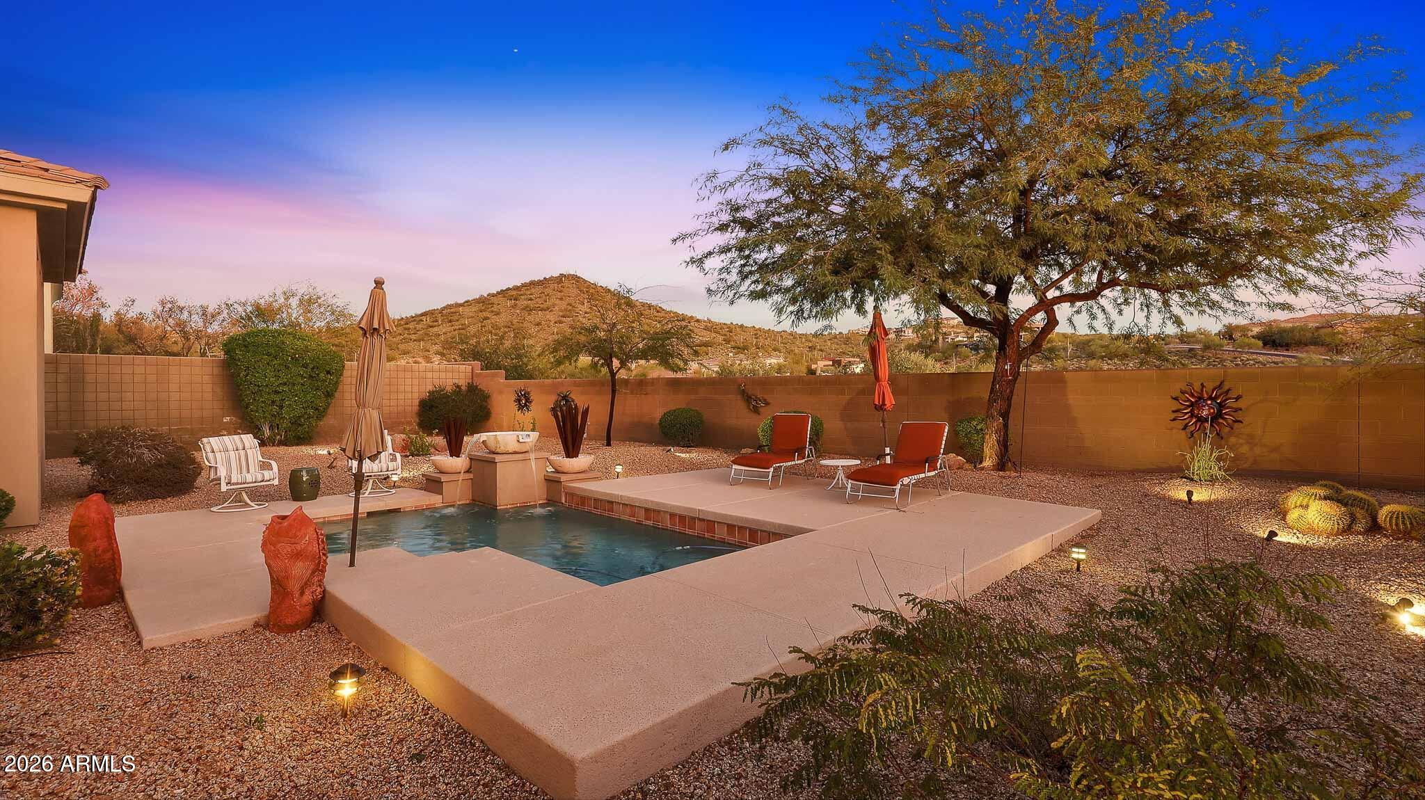 14341 East Geronimo Road Scottsdale, AZ 85259 - Photo 27 of 40 a view of a backyard with sitting area