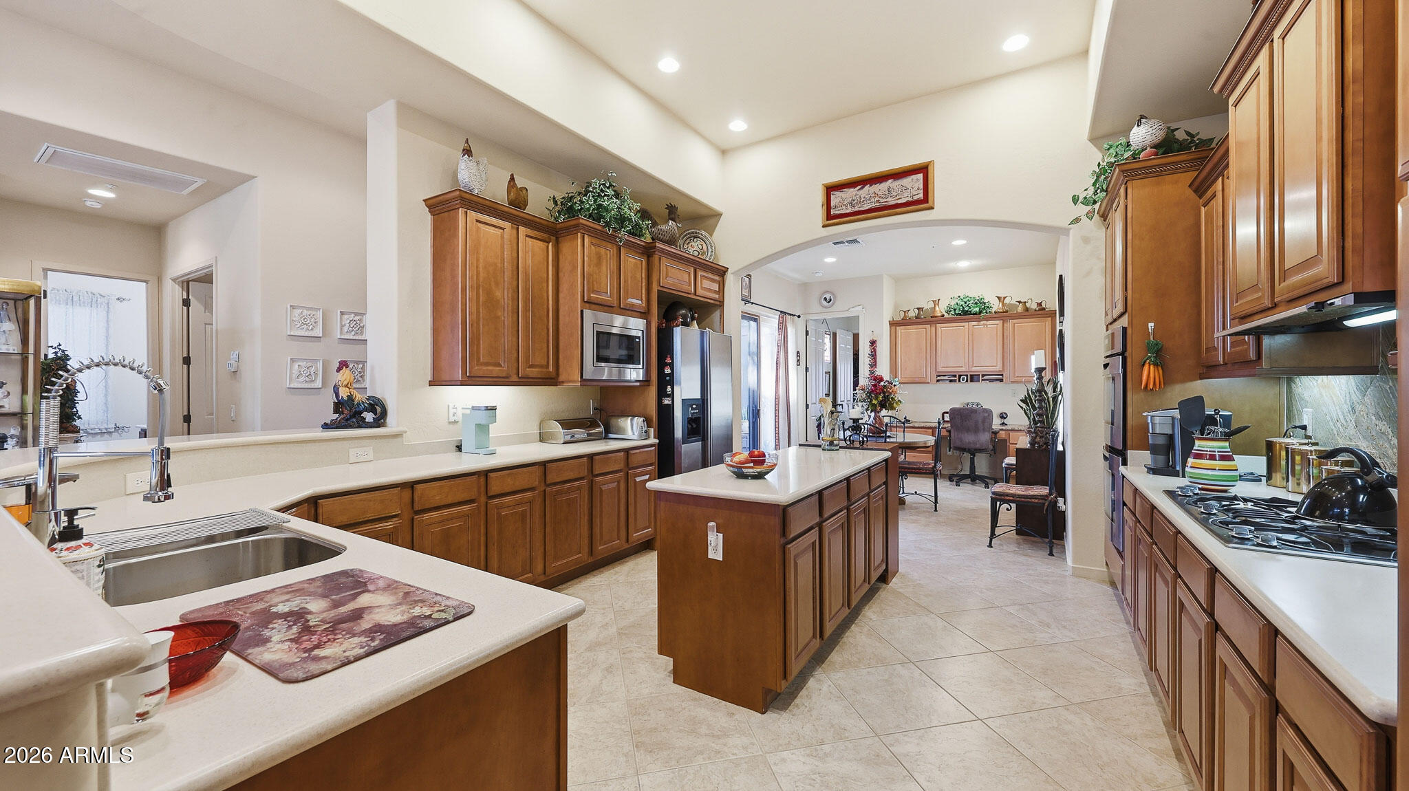 14341 East Geronimo Road Scottsdale, AZ 85259 - Photo 4 of 40 a kitchen with stainless steel appliances a stove sink and cabinets