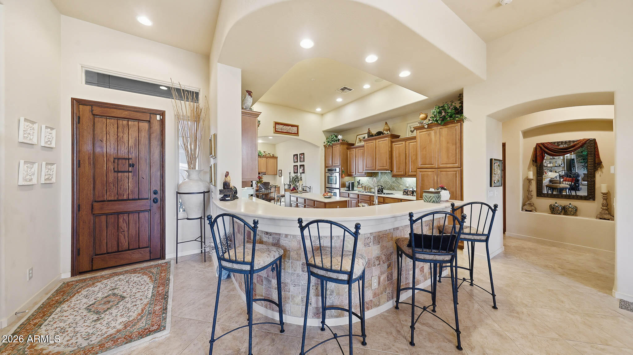14341 East Geronimo Road Scottsdale, AZ 85259 - Photo 7 of 40 a dining hall with stainless steel appliances a dining table and chairs