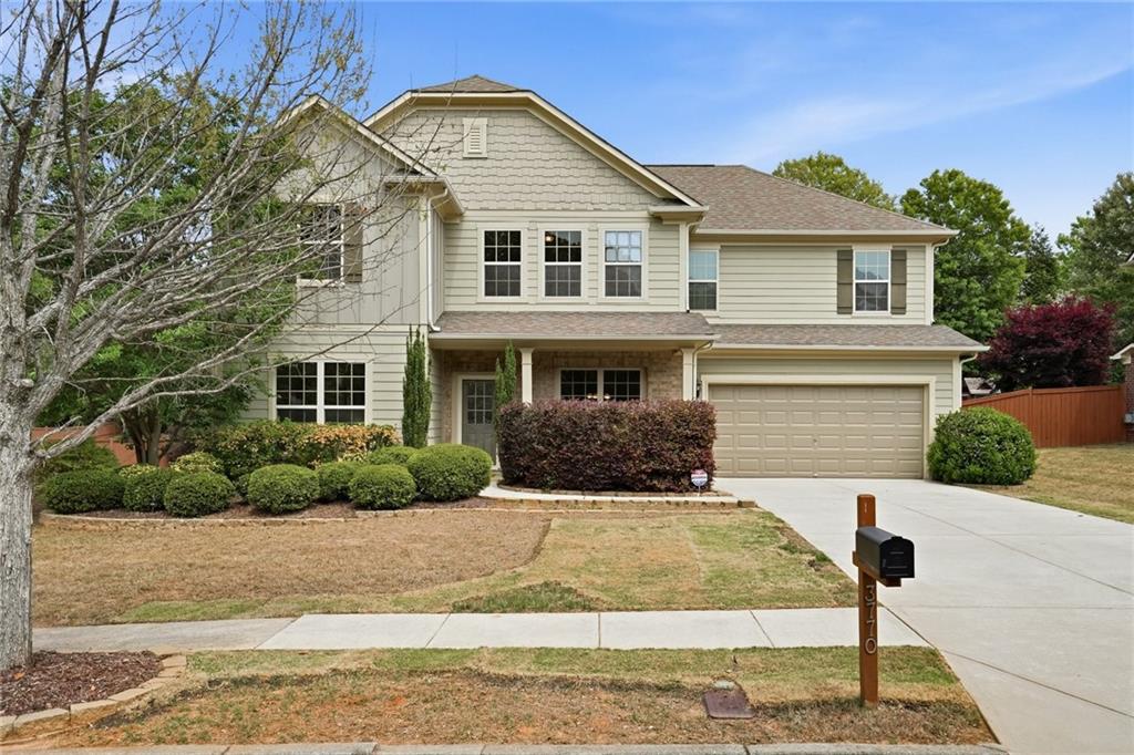 3770 Terrasol Trail Southwest Lilburn, GA 30047 - Photo 1 of 63 a front view of a house with a yard