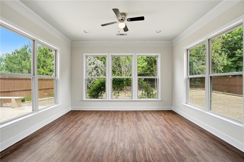 3770 Terrasol Trail Southwest Lilburn, GA 30047 - Photo 15 of 63 a view of empty room with wooden floor and fan