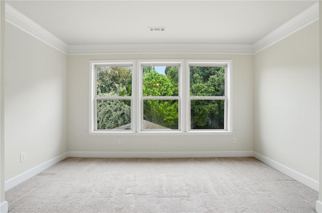 3770 Terrasol Trail Southwest Lilburn, GA 30047 - Photo 20 of 63 an empty room with a window