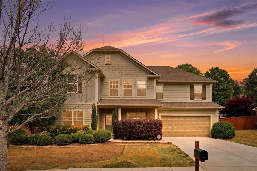 3770 Terrasol Trail Southwest Lilburn, GA 30047 - Photo 2 of 63 a front view of a house with garden