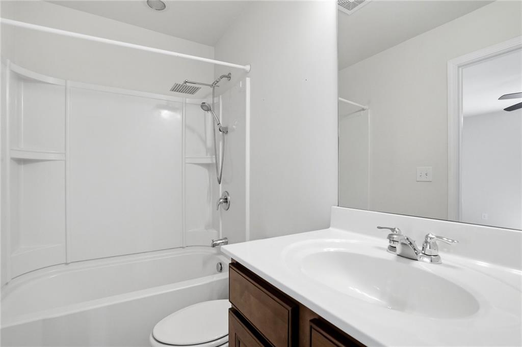 3770 Terrasol Trail Southwest Lilburn, GA 30047 - Photo 28 of 63 a bathroom with a sink toilet tub and shower