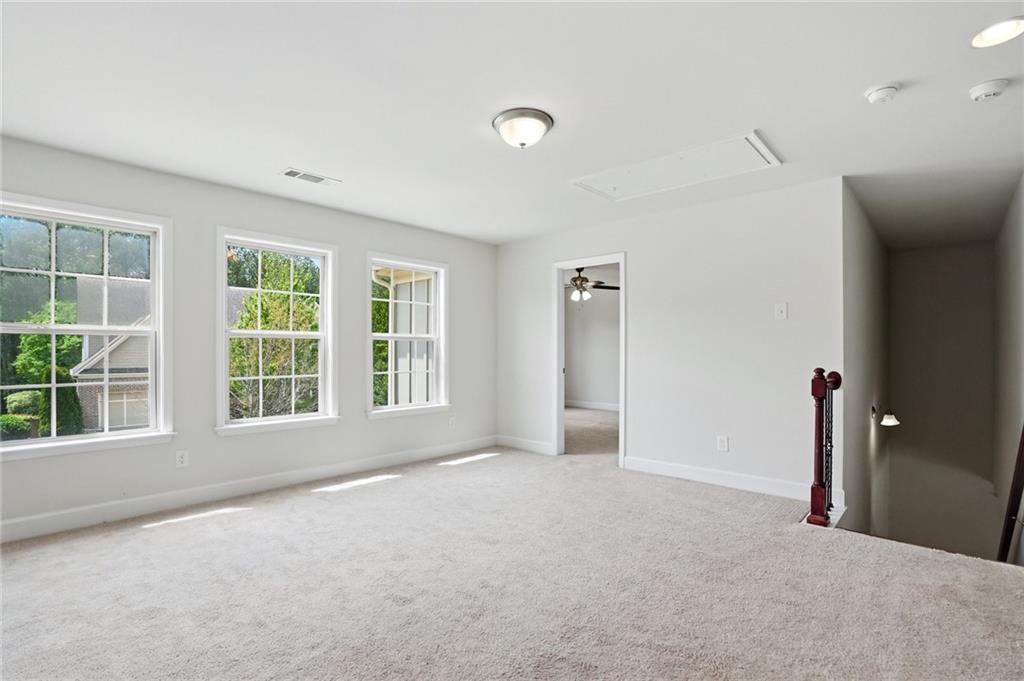 3770 Terrasol Trail Southwest Lilburn, GA 30047 - Photo 32 of 63 an empty room with windows and entrance