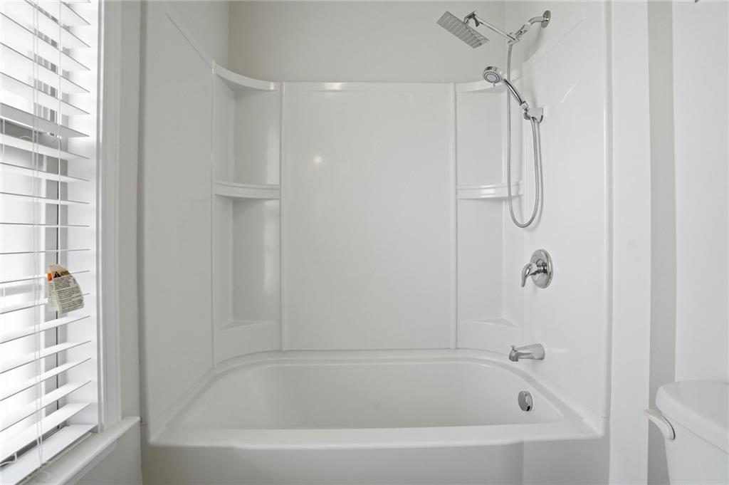3770 Terrasol Trail Southwest Lilburn, GA 30047 - Photo 34 of 63 a close view of a bathtub in bathroom