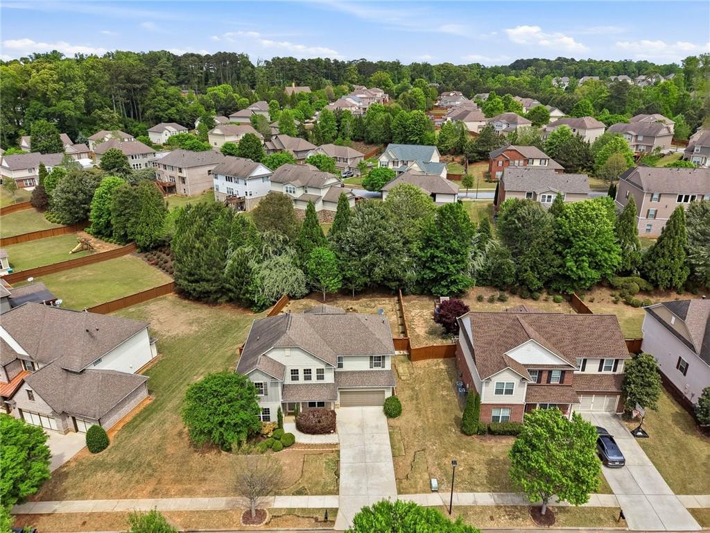 3770 Terrasol Trail Southwest Lilburn, GA 30047 - Photo 43 of 63 an aerial view of residential houses with outdoor space and street view