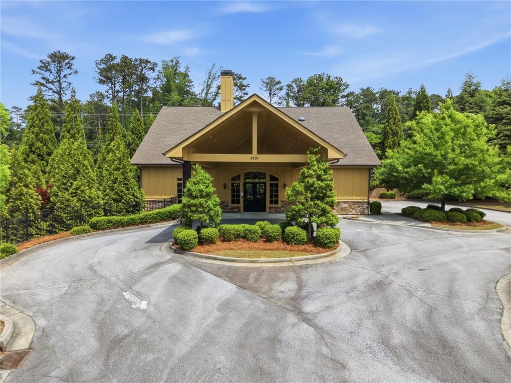 3770 Terrasol Trail Southwest Lilburn, GA 30047 - Photo 60 of 63 a front view of a house with a yard