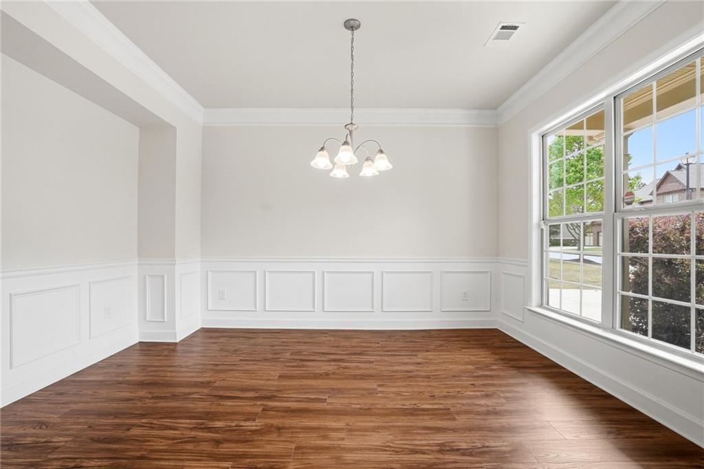 3770 Terrasol Trail Southwest Lilburn, GA 30047 - Photo 9 of 63 a view of a room with wooden floor and windows