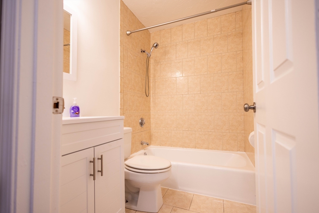 21 Erick Road, Unit 16 Mansfield, MA 02048 - Photo 13 of 28 a bathroom with a sink a toilet and shower