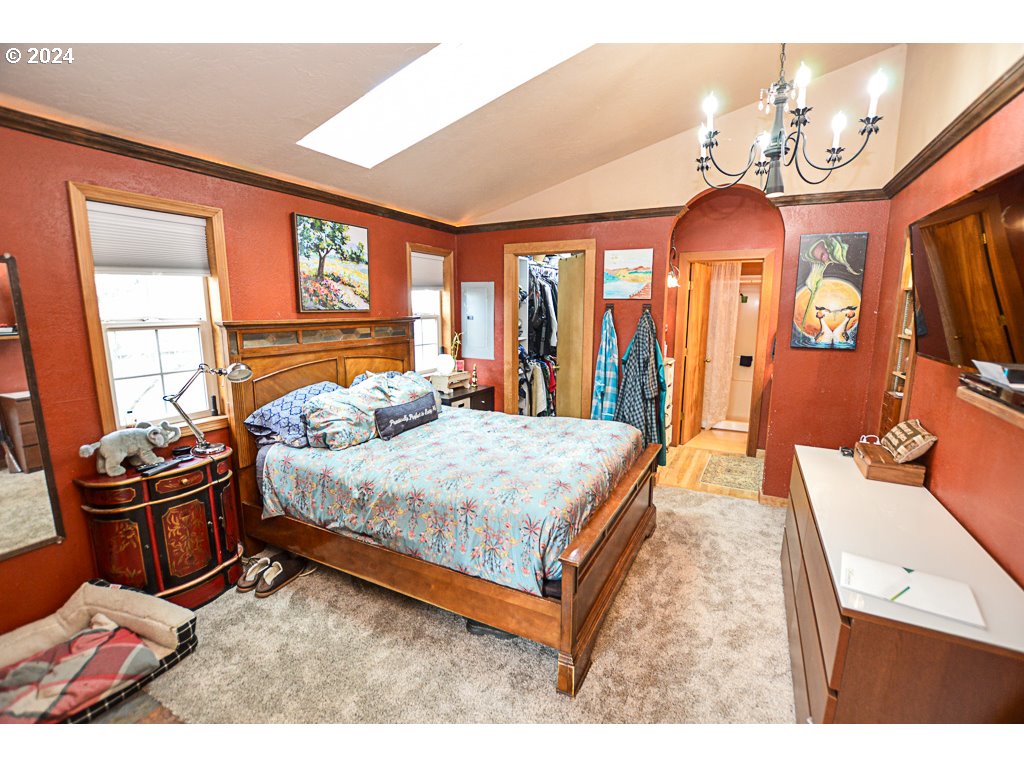 251 18th Street Springfield, OR 97477 - Photo 14 of 26 a bed room with a bed and a tv