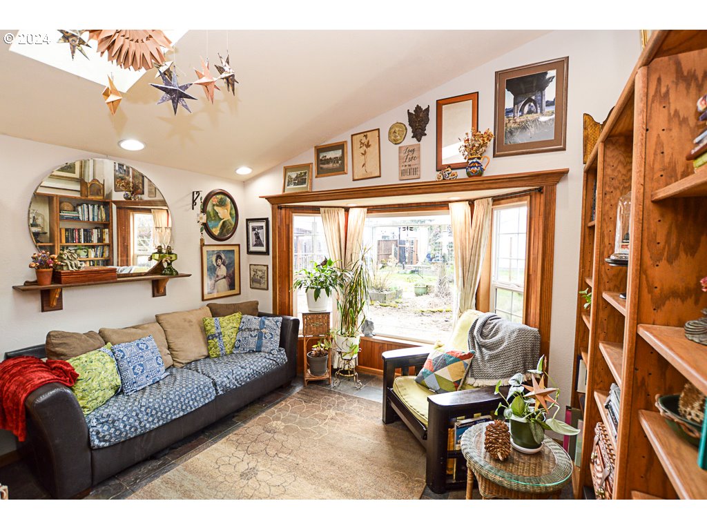 251 18th Street Springfield, OR 97477 - Photo 8 of 26 a living room with furniture and a large window