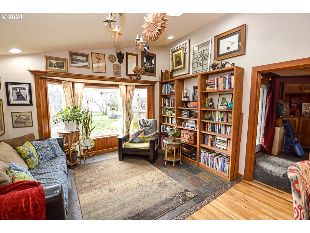 251 18th Street Springfield, OR 97477 - Photo 9 of 26 a living room with furniture and a book shelf