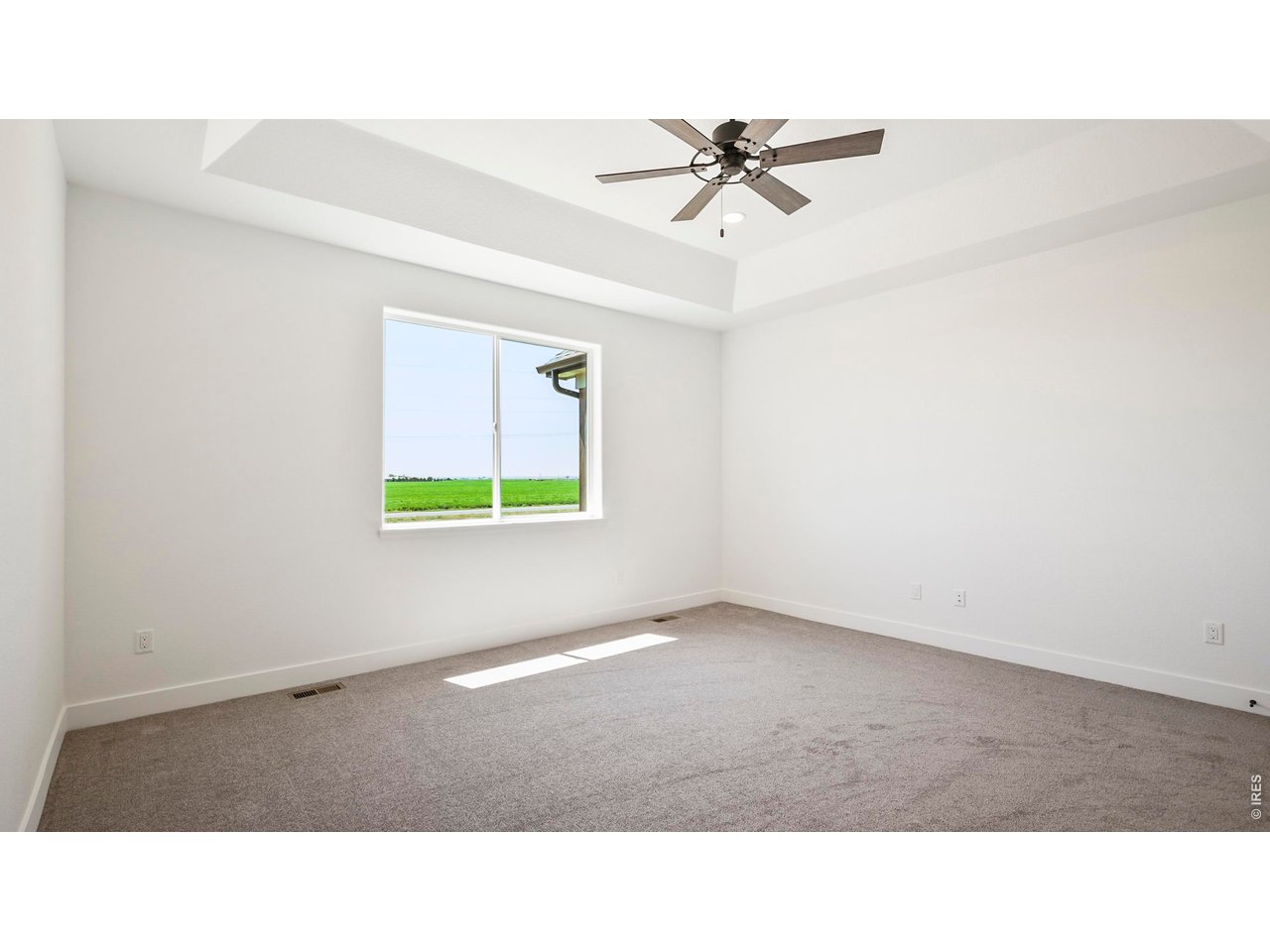 448 Cache Avenue Fort Morgan, CO 80701 - Photo 15 of 43 a room with a window and a ceiling fan