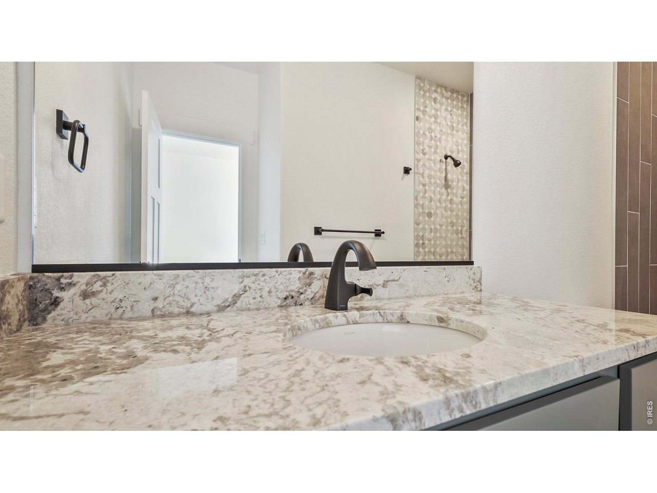 448 Cache Avenue Fort Morgan, CO 80701 - Photo 22 of 43 a bathroom with a sink and a mirror