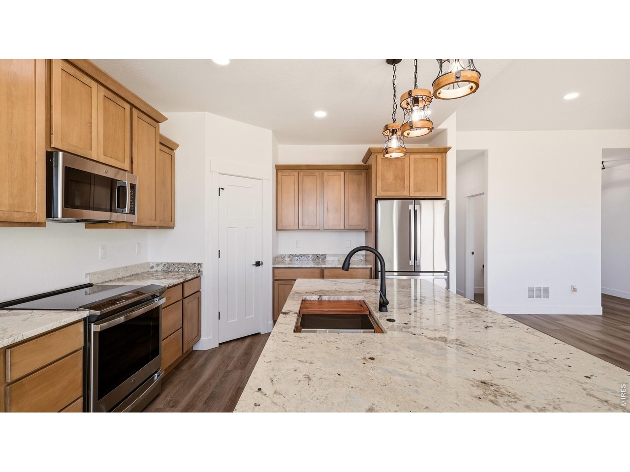448 Cache Avenue Fort Morgan, CO 80701 - Photo 9 of 43 a kitchen with a sink appliances and cabinets