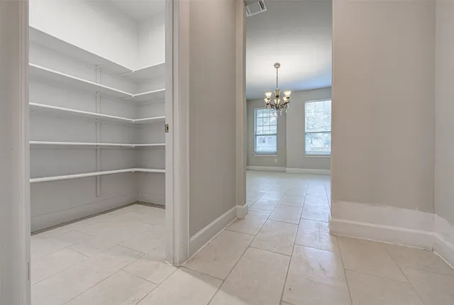 a view of a room with walk in closet and window