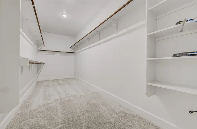 a view of a room with racks on the wall