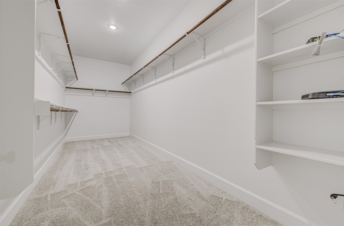 316 Buffalo Ridge Drive Manchaca, TX 78652 - Photo 16 of 37 a view of a room with racks on the wall