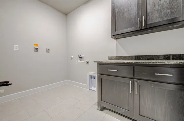 a view of a kitchen with dishwasher and cabinets