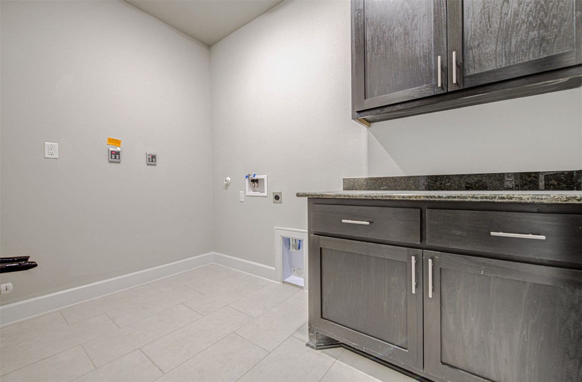 316 Buffalo Ridge Drive Manchaca, TX 78652 - Photo 17 of 37 a view of a kitchen with dishwasher and cabinets