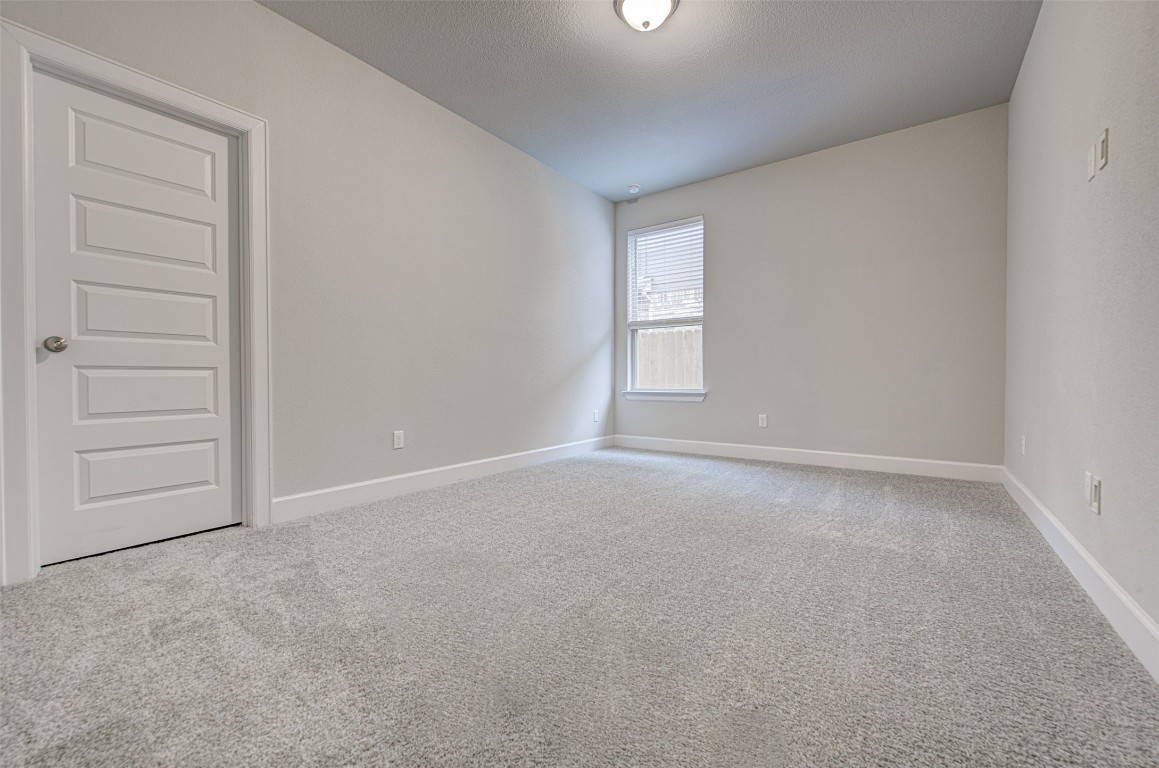 316 Buffalo Ridge Drive Manchaca, TX 78652 - Photo 19 of 37 a view of empty room with a window