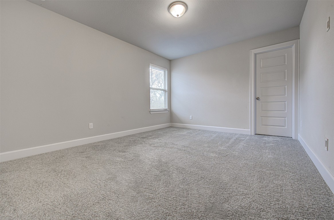 316 Buffalo Ridge Drive Manchaca, TX 78652 - Photo 23 of 37 an empty room with windows and closet