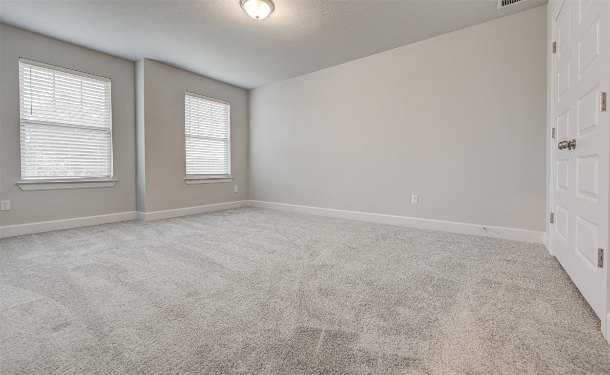 316 Buffalo Ridge Drive Manchaca, TX 78652 - Photo 25 of 37 an empty room with windows