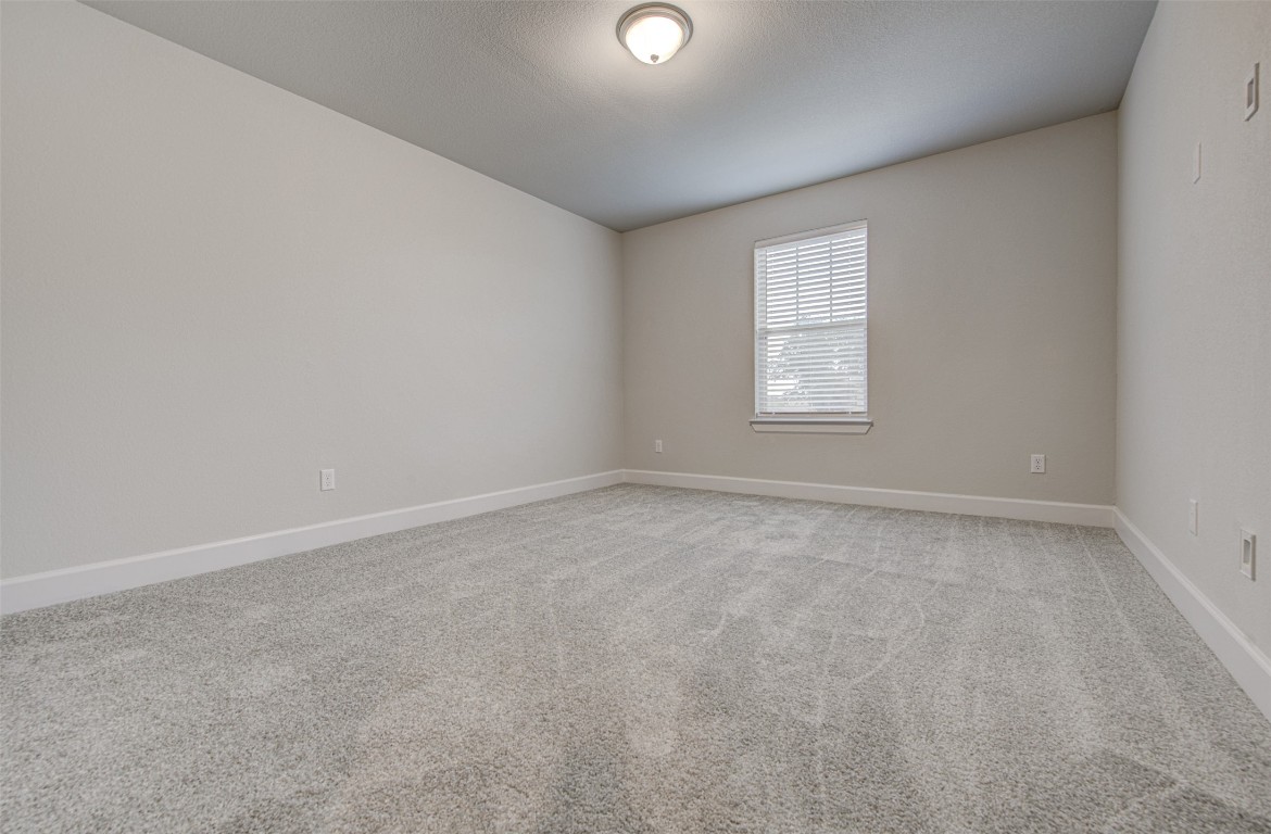 316 Buffalo Ridge Drive Manchaca, TX 78652 - Photo 28 of 37 an empty room with windows