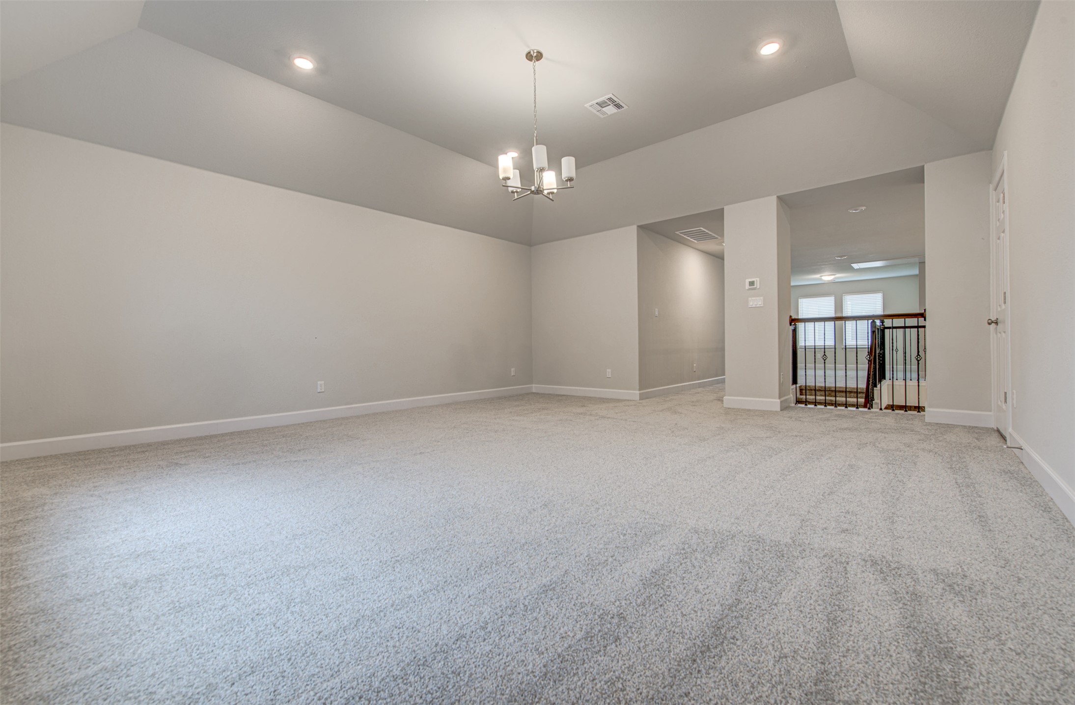 316 Buffalo Ridge Drive Manchaca, TX 78652 - Photo 29 of 37 an empty room with a empty space and a chandelier fan