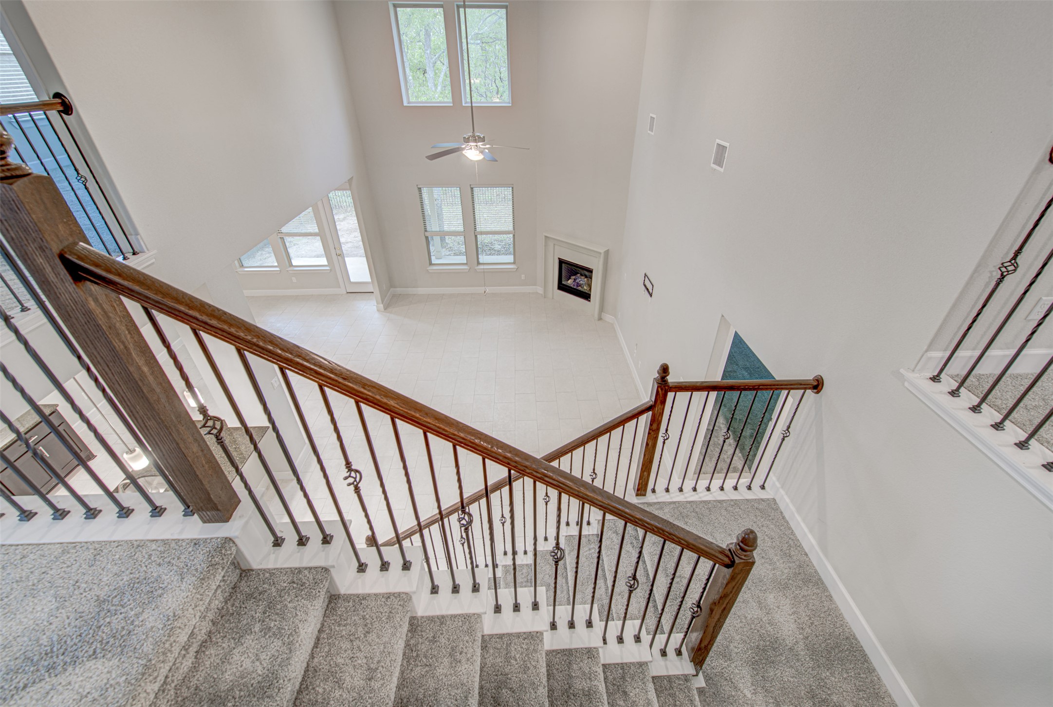 316 Buffalo Ridge Drive Manchaca, TX 78652 - Photo 30 of 37 a view of staircase with railing and a chandelier