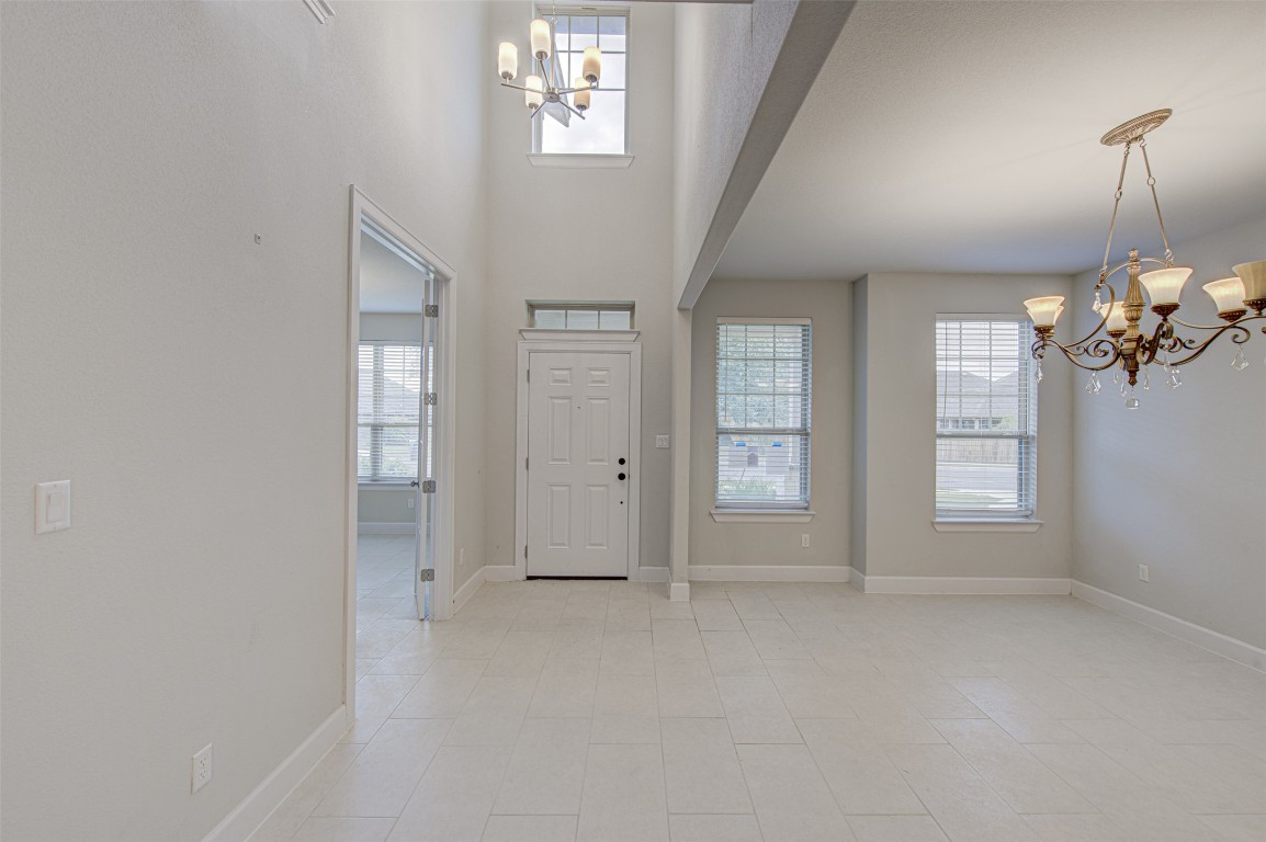 316 Buffalo Ridge Drive Manchaca, TX 78652 - Photo 3 of 37 wooden floor in an empty room with a window
