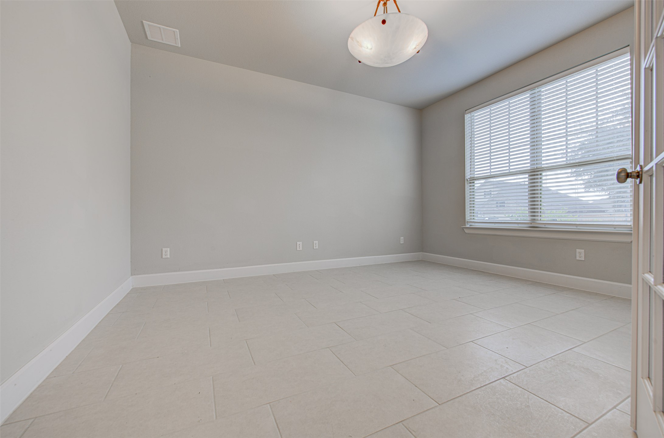 316 Buffalo Ridge Drive Manchaca, TX 78652 - Photo 5 of 37 an empty room with a window