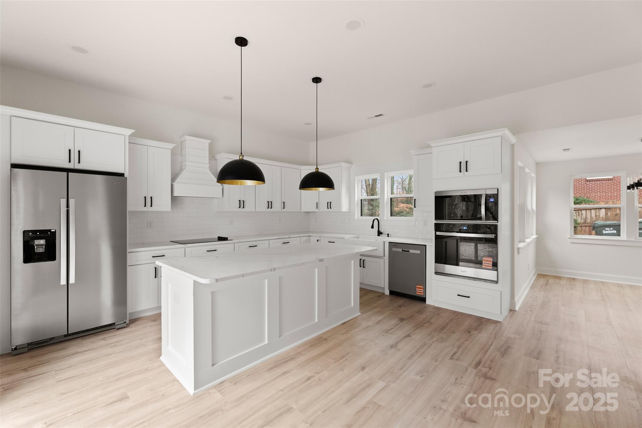 3021 Whitson Road Gastonia, NC 28054 - Photo 13 of 31 a kitchen with stainless steel appliances a stove refrigerator sink and oven
